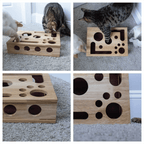 Cat playing with wooden puzzle box