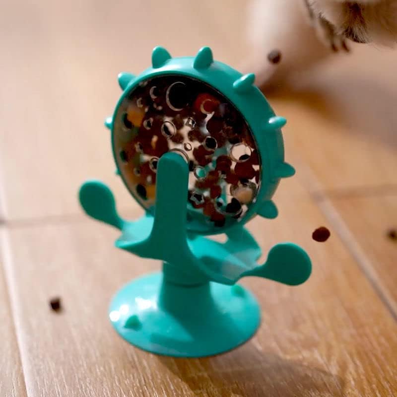Rotating treat wheel toy in green
