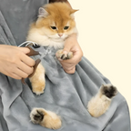 Cat grooming apron worn by owner