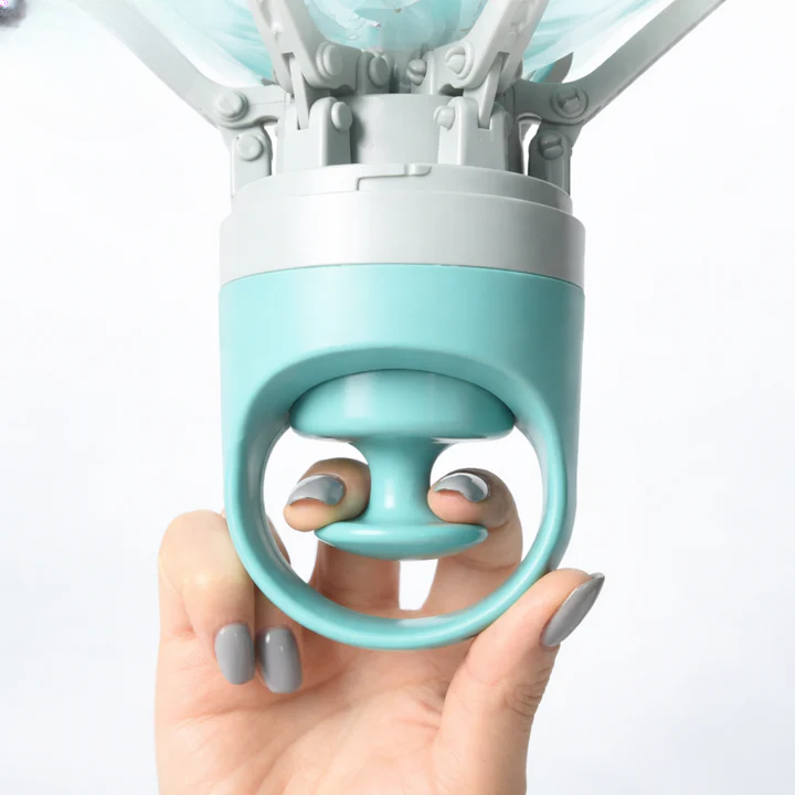 Poop scooper in use on grass
