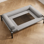 Raised dog bed with breathable woven centre