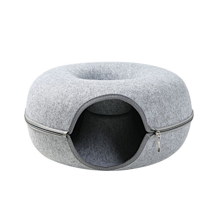 Cat inside round felt house
