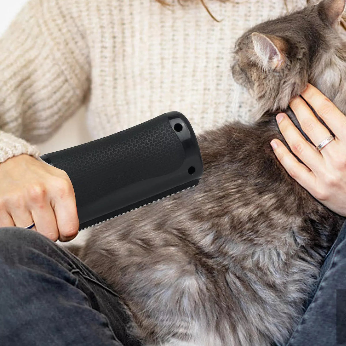 Grooming brush in use on a cat