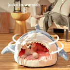 Cat resting in shark bed