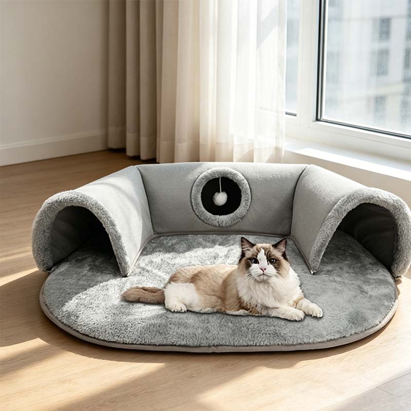 Cat resting in plush cave bed