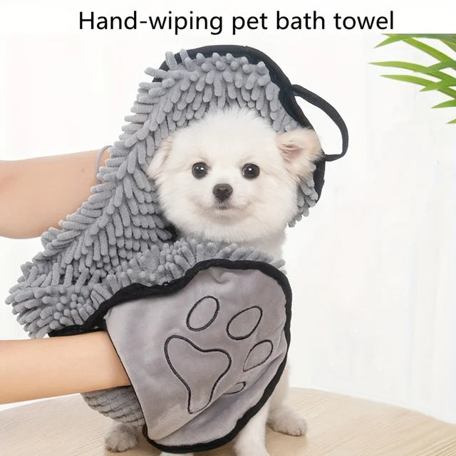 Drying a small dog with the hand-pocket towel