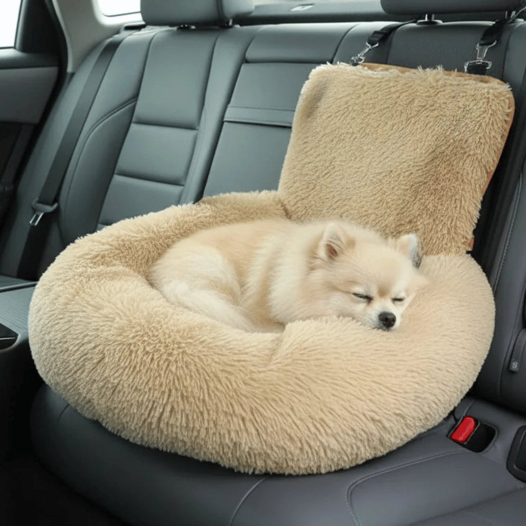 Beige plush dog car seat bed with high backrest, raised sides and black safety strap on car seat (view 5)