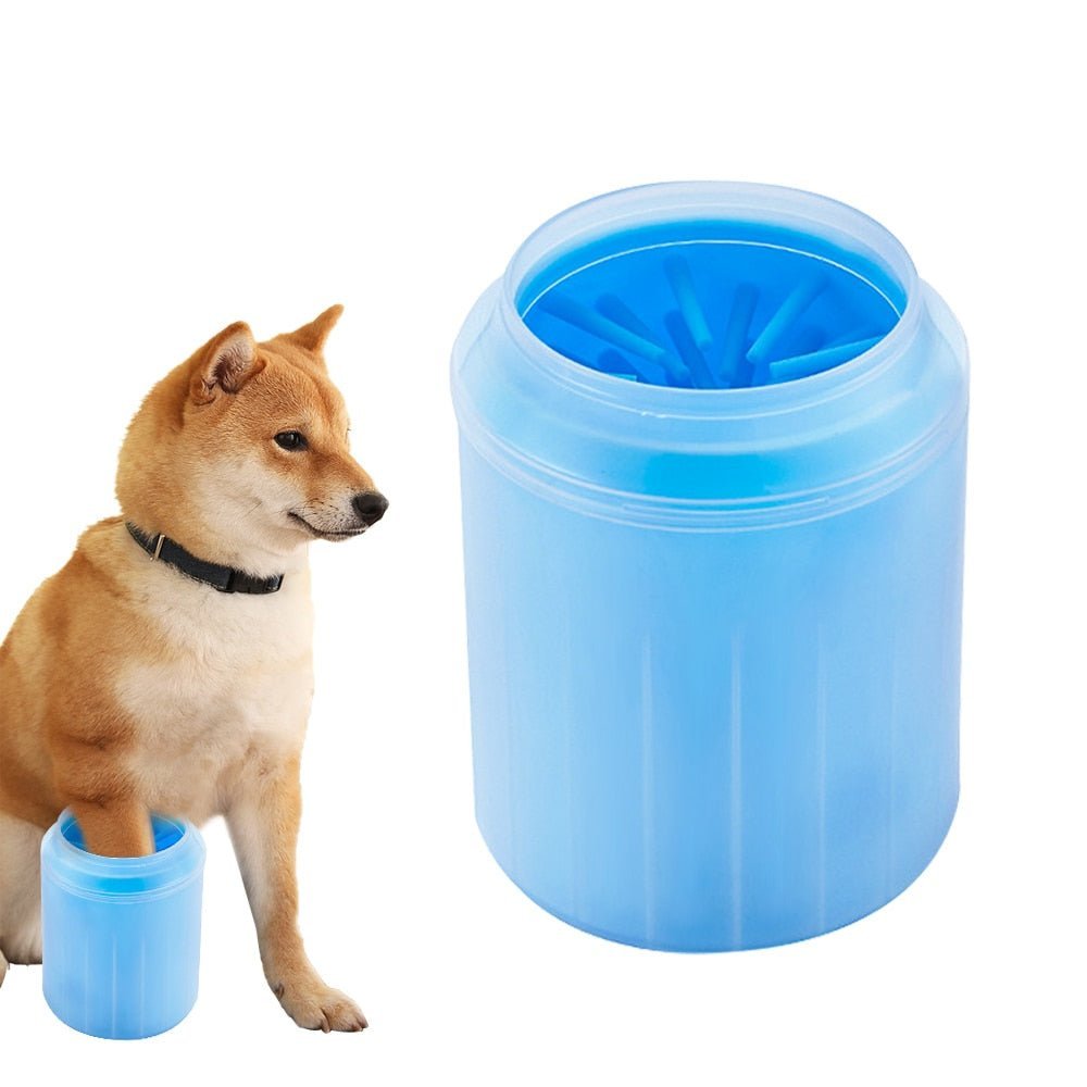 Blue silicone dog paw cleaner cup held in a hand next to a sitting Shiba Inu dog (view 8)