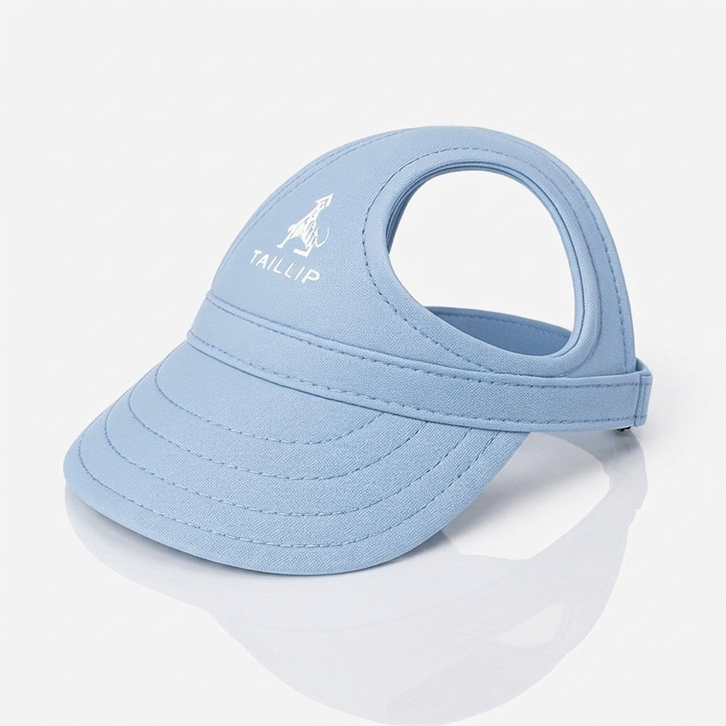 Light blue dog sun visor cap with wide brim and ear holes worn by a dog at the beach (view 2)