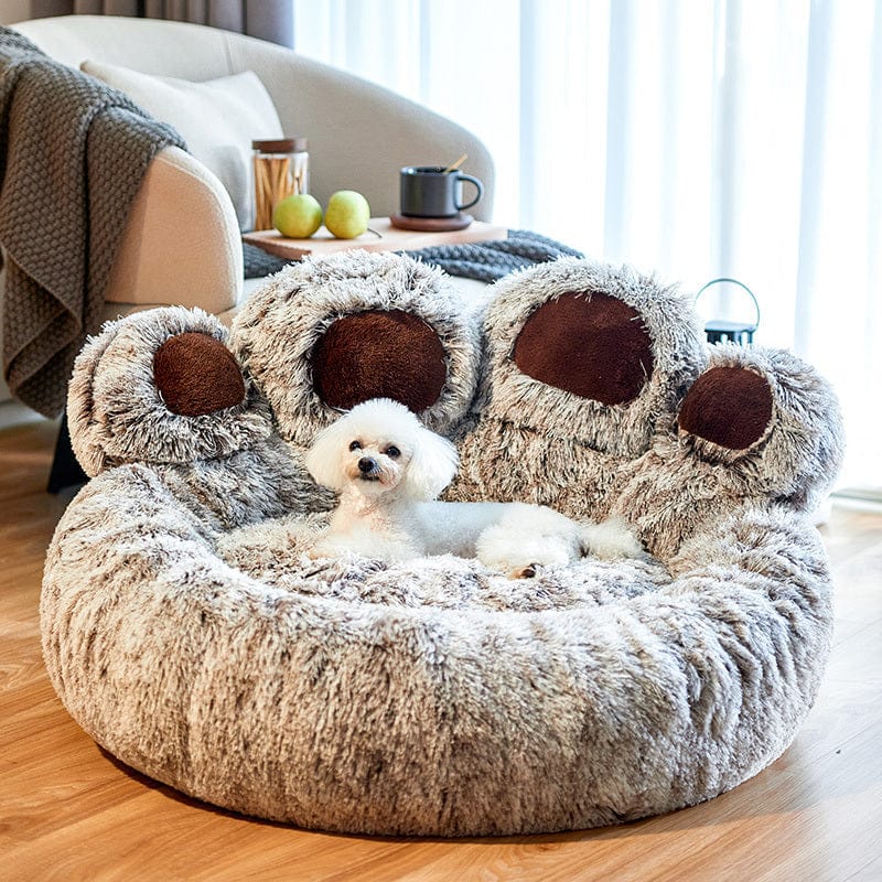 Dog relaxing in the grey paw bed