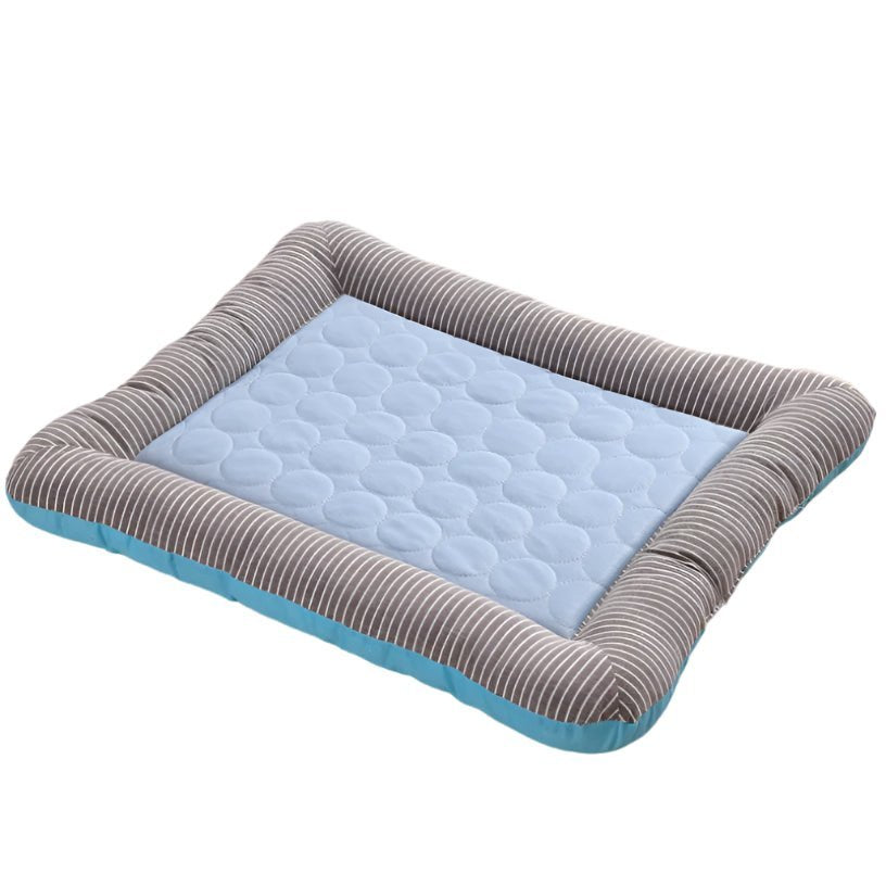 Pink pet cooling mat with striped bolster edges and quilted center, dog resting on it indoors (view 2)