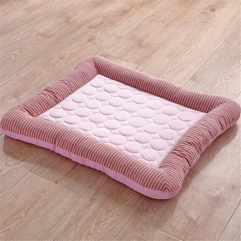 Pink pet cooling mat with striped bolster edges and quilted center, dog resting on it indoors (view 7)