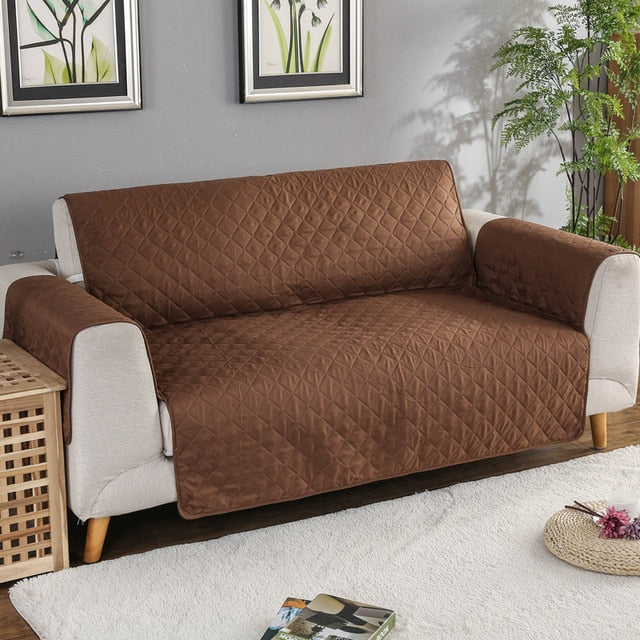 Brown quilted sofa protector