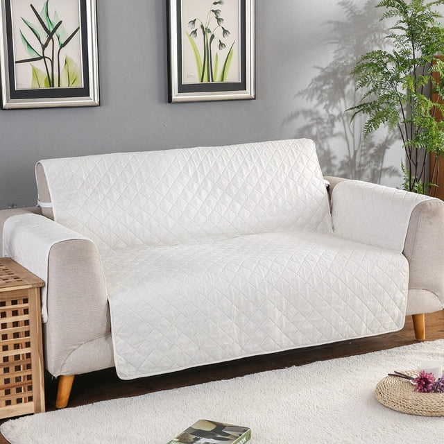 White quilted sofa protector