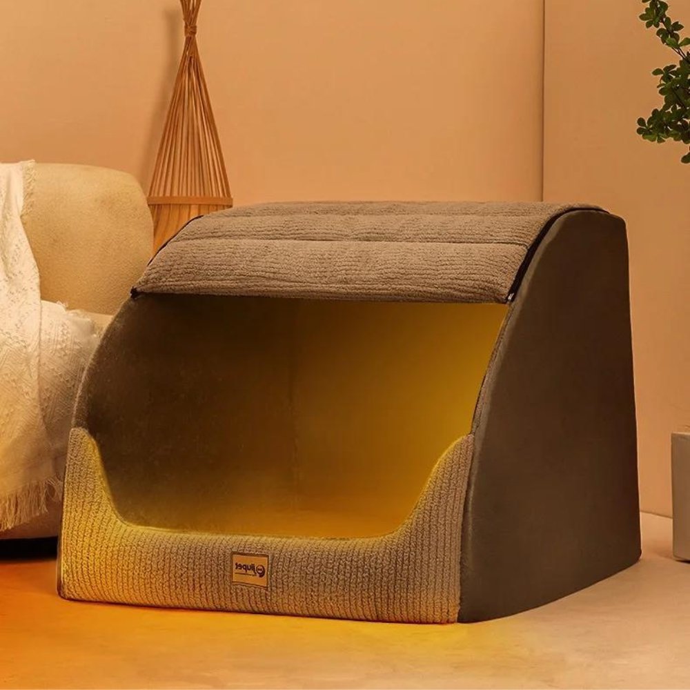 Dog resting in an enclosed pet cave bed
