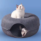 Cat resting in felt cat cave